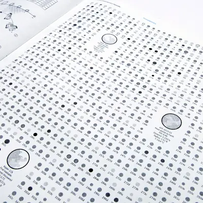 Angled view of an infographic page covered in a dense grid of tiny grey and black little planets labelled with alphanumeric codes. Three large planets callouts break up the grid to display data for the exoplanets Kepler-296d, KOI-3010.01, and Kepler-22b.